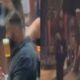 Jason-Kelce-holds-a-beer-in-his-mouth